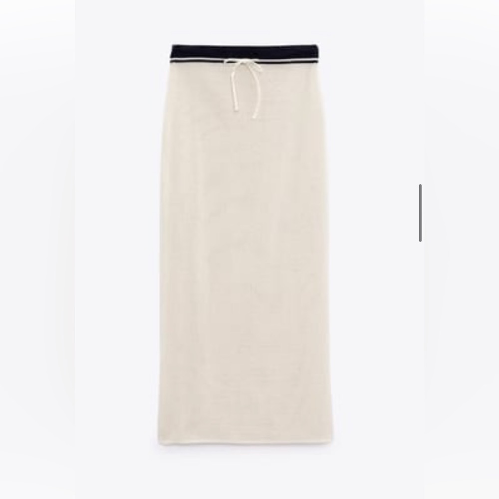 Zara 
COMBO LETTER POLO
Matching skirt
